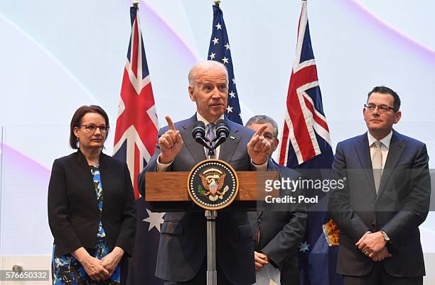 Vice-President Joe Biden speaks to guests with Victorian Premier Daniel Andrews , Health Minister Susan Ley and Professor Jim Bishop after a tour of...