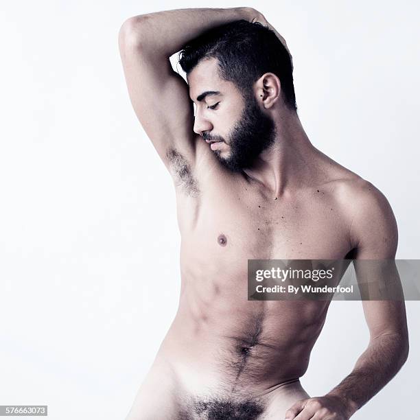 male dancer with beard posing nude - cabello púbico fotografías e imágenes de stock