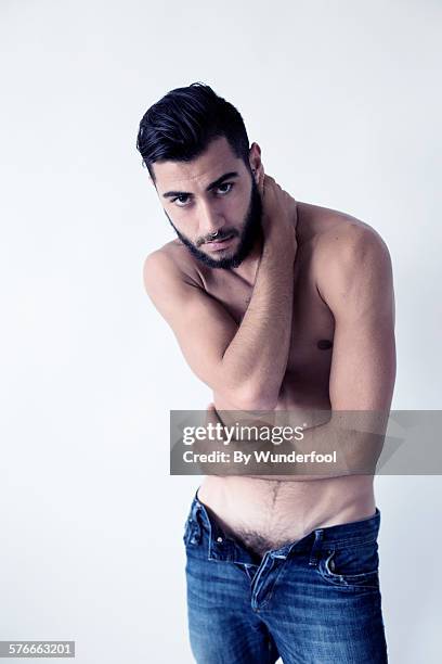 male dancer in open blue jeans - pubic hair stock pictures, royalty-free photos & images