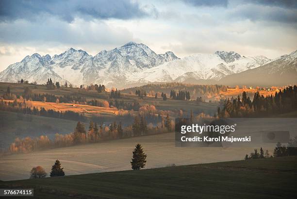 mountains at sunset - tatra stock-fotos und bilder