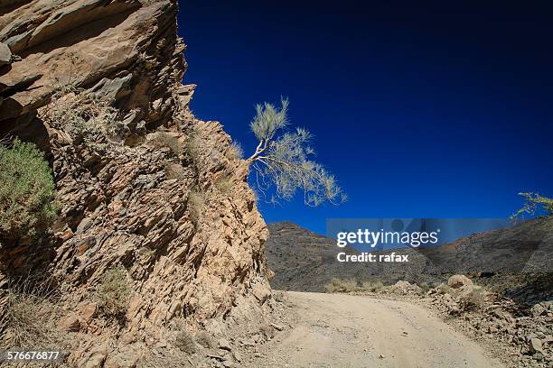 montain road via hatt and wadi bani awf - hatt stock pictures, royalty-free photos & images