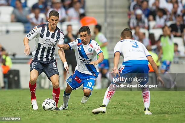 Hiram Mier of Monterrey fights for the ball with Christian Bermudez of Puebla during the 1st round match between Monterrey and Puebla as part of the...