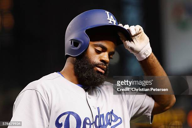 Andrew Toles of the Los Angeles Dodgers reacts after striking out against the Arizona Diamondbacks during the eighth inning of the MLB game at Chase...