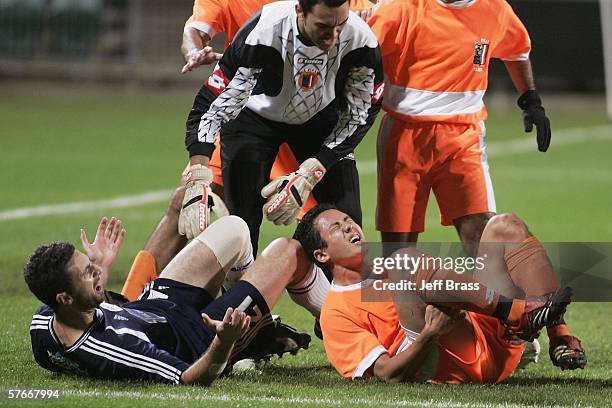 Tempers boil over after a tackle by Riki van Steeden of Auckland City FC on injured Raimana Li Fung Kuee of AS Pirae during the OFC Club Championship...