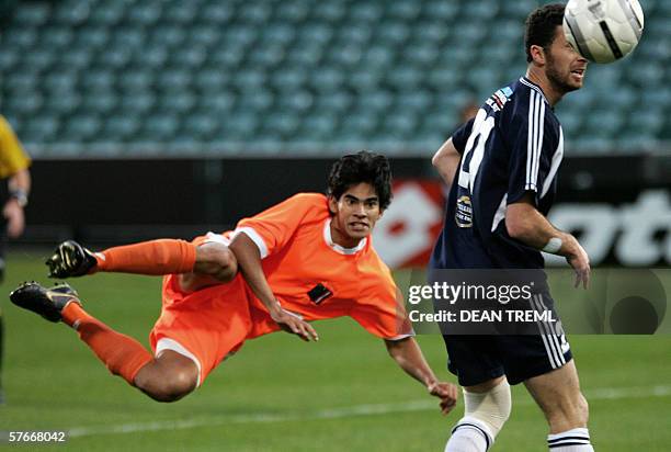 Axel Williams of Tahiti's AS Pirae FC takes a shot past Riki Van Steeden of New Zealand's Auckland City FC during the final of the Oceania Football...