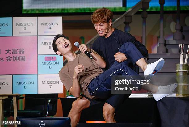 South Korean actor Song Joong-ki , South Korean singer and host Kim Jong-kook attend Song Joong-ki's fan meeting on July 16, 2016 in Shanghai, China.