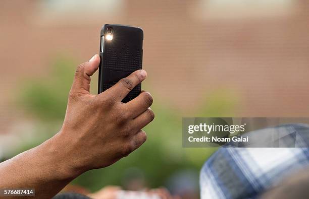 View of a fan holding up a phone during the 12th Annual Brooklyn Hip Hop Festival finale concert at Brooklyn Bridge Park on July 16, 2016 in New York...