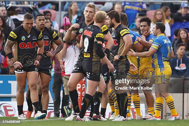 Bureta Faraimo of the Eels celebrates with his team mates after scoring a try during the round 19 NRL match between the Penrith Panthers and the...