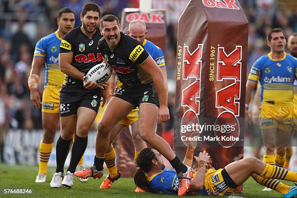 Reagan Campbell-Gillard of the Panthers celebrates scoring a try during the round 19 NRL match between the Penrith Panthers and the Parramatta Eels...