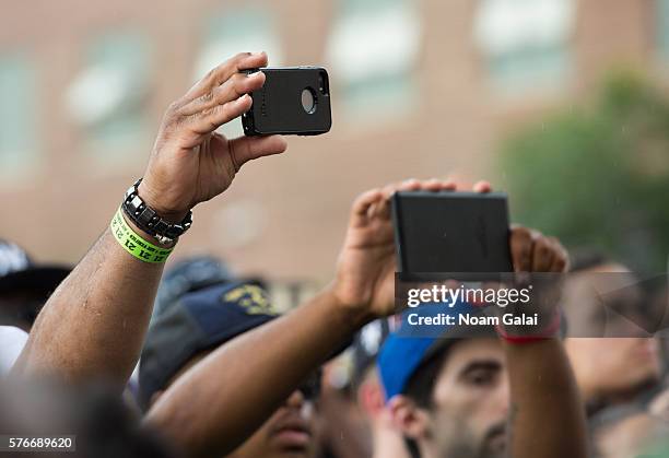 View of fans holding up phones during the 12th Annual Brooklyn Hip Hop Festival finale concert at Brooklyn Bridge Park on July 16, 2016 in New York...