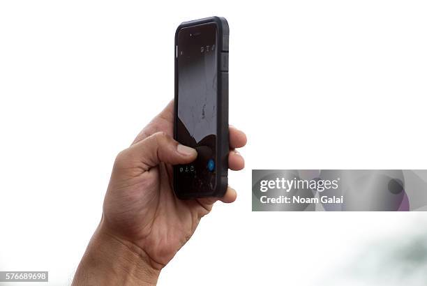 View of a person holding up a phone during the 12th Annual Brooklyn Hip Hop Festival finale concert at Brooklyn Bridge Park on July 16, 2016 in New...