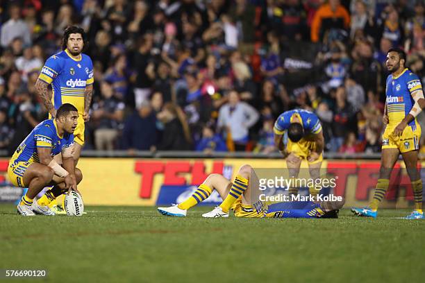 The Eels look dejected after defeat during the round 19 NRL match between the Penrith Panthers and the Parramatta Eels at Pepper Stadium on July 17,...
