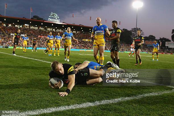 Bryce Cartwright of the Panthers scores a try during the round 19 NRL match between the Penrith Panthers and the Parramatta Eels at Pepper Stadium on...