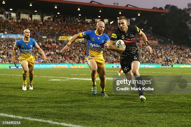 Bryce Cartwright of the Panthers scores a try during the round 19 NRL match between the Penrith Panthers and the Parramatta Eels at Pepper Stadium on...