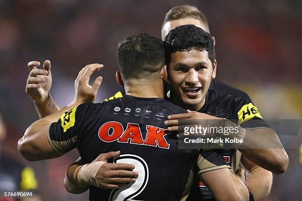 Josh Mansour and Dallin Watene Zelezniak of the Panthers celebrate Josh Mansour scoring a try during the round 19 NRL match between the Penrith...