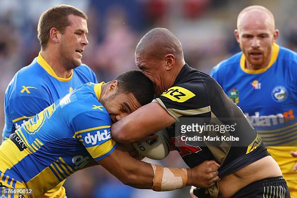 Peni Terepo of the Eels tackles Leilani Latu of the Panthers during the round 19 NRL match between the Penrith Panthers and the Parramatta Eels at...