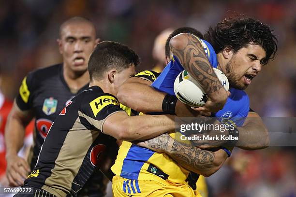 Rory O'Brien of the Eels is tackled during the round 19 NRL match between the Penrith Panthers and the Parramatta Eels at Pepper Stadium on July 17,...