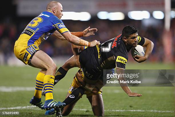 Tyrone Peachey of the Panthers is tackled during the round 19 NRL match between the Penrith Panthers and the Parramatta Eels at Pepper Stadium on...