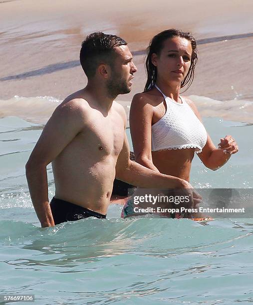 Barcelona football player Jordi Alba and Romarey Ventura are seen on July 3, 2016 in Ibiza, Spain.