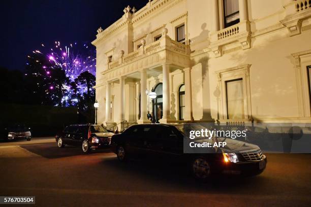 Fireworks go off behind the car of US Vice President Joe Biden during a dinner at Government House in Melbourne on July 17, 2016. Biden earlier in...