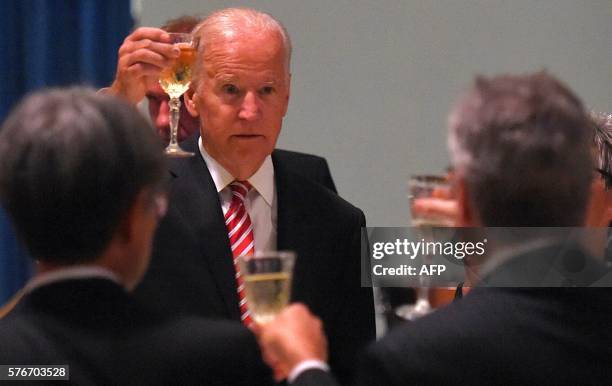 Vice President Joe Biden gives a toast at a dinner at Government House in Melbourne on July 2016. Biden earlier in the day unveiled a series of...