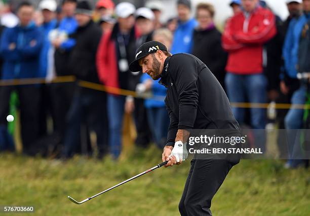 Golfer Dustin Johnson chips onto the 4th green during his final round on day four of the 2016 British Open Golf Championship at Royal Troon in...