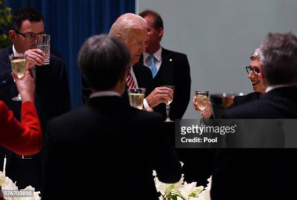 Vice President Joe Biden toasts the Governor of Victoria Linda Dessau and Victorian Premier Daniel Andrews after his speech during a dinner at...