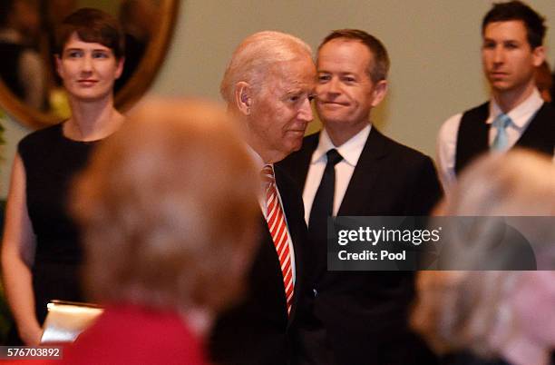 Vice President Joe Biden walks past Opposition Leader Bill Shorten as he arrives at a dinner held by the Governor of Victoria Linda Dessau at...