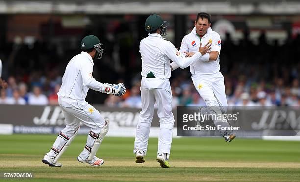 Pakistan bowler Yasir Shah is congratulated by team mates after bowling England batsman Gary Ballance during day four of the 1st Investec Test match...