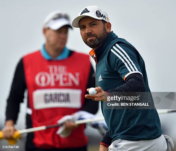 Spain's Sergio Garcia reacts after holing his putt on the 4th green during his final round on day four of the 2016 British Open Golf Championship at...