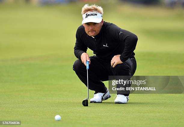 Denmark's Soren Kjeldsen lines up a putt on the 4th green during his final round on day four of the 2016 British Open Golf Championship at Royal...