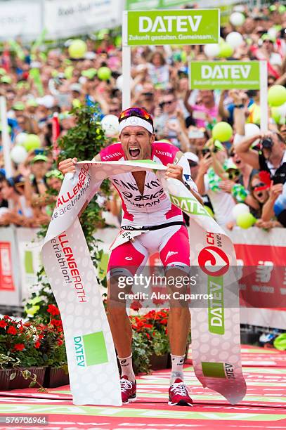 Jan Frodeno of Germany celebrates as he wins Challenge Triathlon Roth and sets a new world record on July 17, 2016 in Roth, Germany.