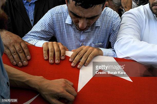 Relatives and friends mourn at the funeral service for victims of the thwarted coup in Istanbul at Fatih mosque on July 17, 2016 in Istanbul, Turkey....