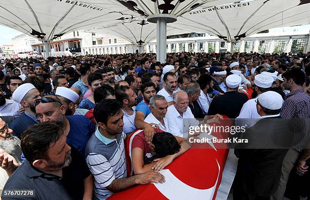 Relatives and friends mourn at the funeral service for victims of the thwarted coup in Istanbul at Fatih mosque on July 17, 2016 in Istanbul, Turkey....