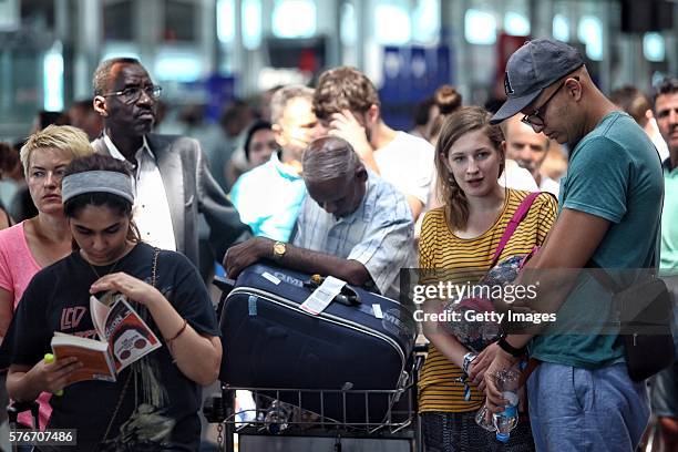 International passengers wait for flight information after flights to Ataturk Airport were delayed or cancelled on July 17, 2016 in Istanbul, Turkey....