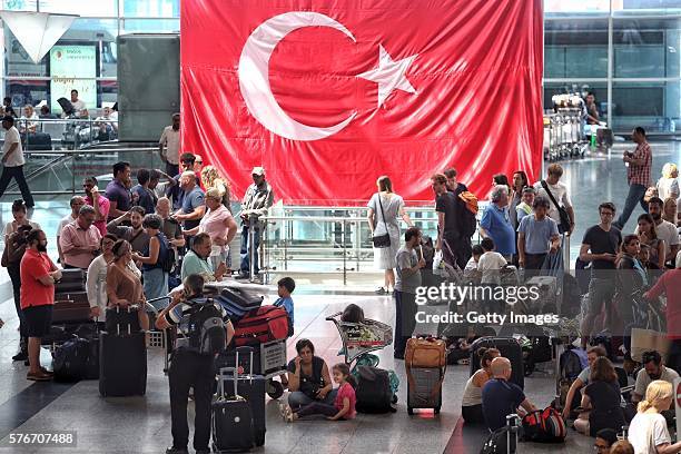 International passengers wait for flight information after flights to Ataturk Airport were delayed or cancelled on July 17, 2016 in Istanbul, Turkey....