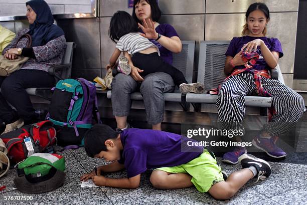 International passengers wait for flight information after flights to Ataturk Airport were delayed or cancelled on July 17, 2016 in Istanbul, Turkey....