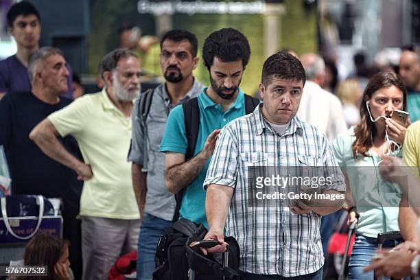 International passengers wait for flight information after flights to Ataturk Airport were delayed or cancelled on July 17, 2016 in Istanbul, Turkey....