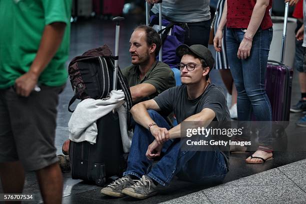 International passengers wait for flight information after flights to Ataturk Airport were delayed or cancelled on July 17, 2016 in Istanbul, Turkey....