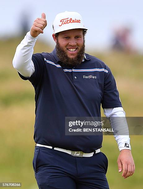 England's Andrew Johnston gestures as he arrives at the 4th green during his final round on day four of the 2016 British Open Golf Championship at...