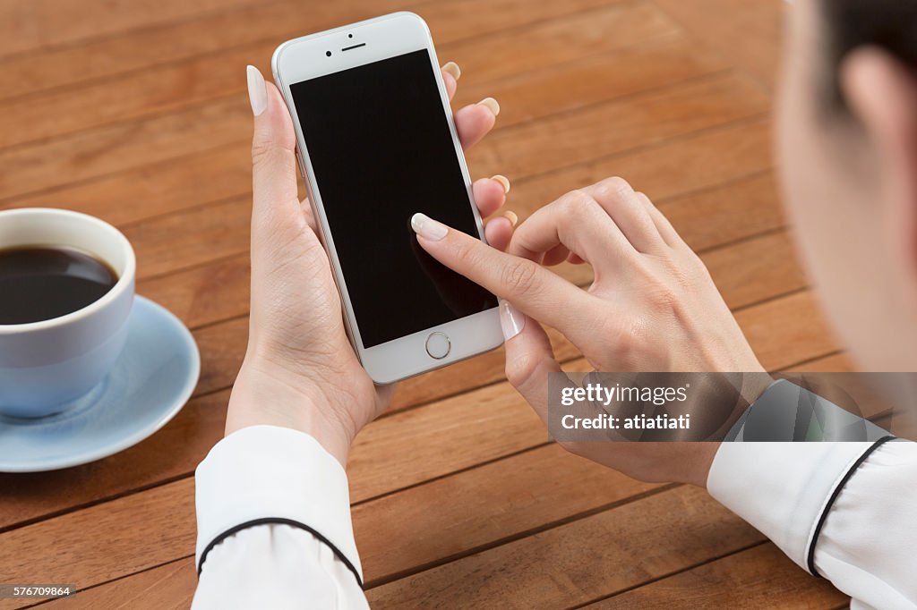 Female Using Iphone Woman Using Iphone 6 High-Res Stock Photo - Getty Images