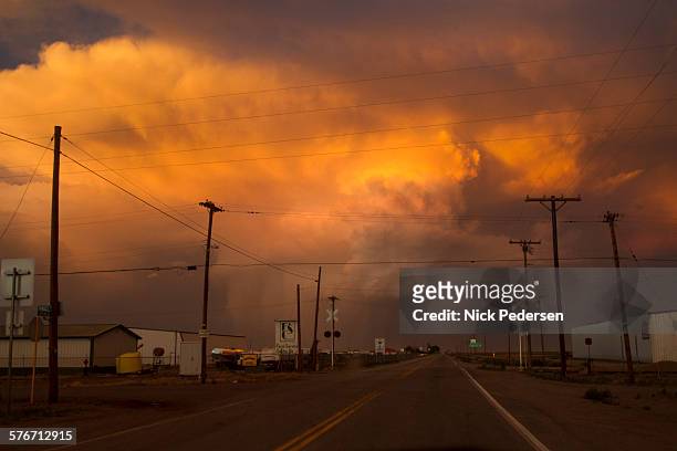 sunset storm - small town stock pictures, royalty-free photos & images