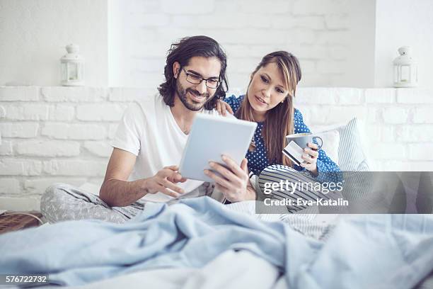 young couple at home - hipster coffee shop candid stock pictures, royalty-free photos & images