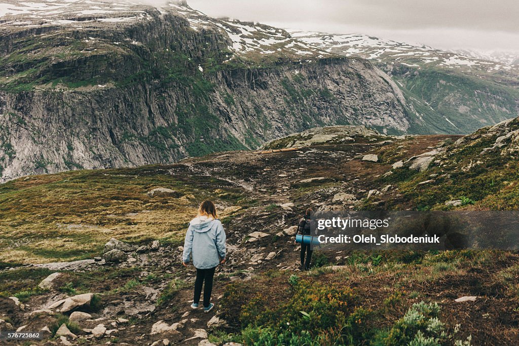 Two people hiking in mountains