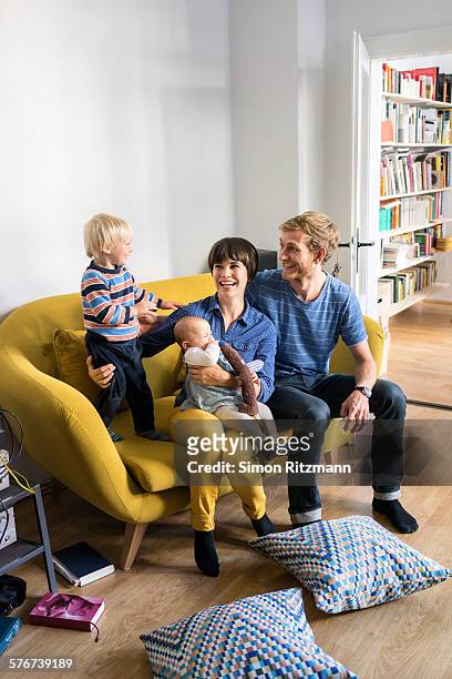 happy young family at home. - family caucasian fotografías e imágenes de stock