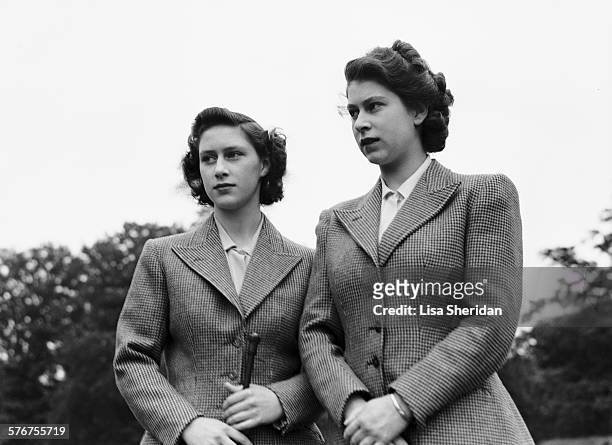 Princess Elizabeth and her sister Princess Margaret wearing riding habits at the Royal Lodge, Windsor, UK, 8th July 1946.