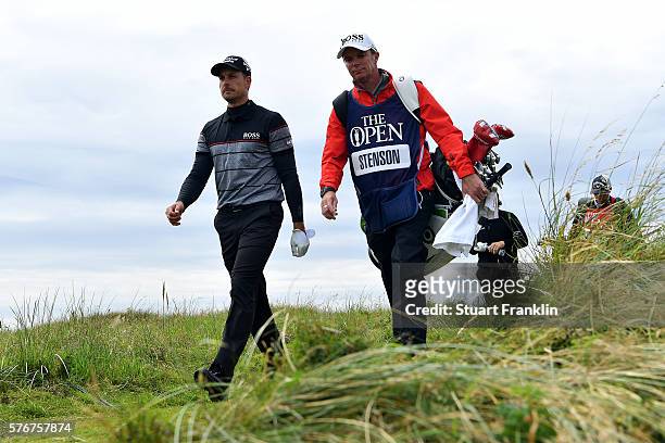 Henrik Stenson of Sweden and his caddie Gareth Lord walk on the 4th during the final round on day four of the 145th Open Championship at Royal Troon...