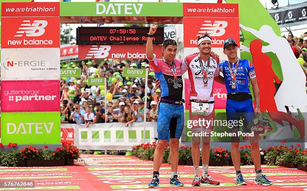 Winner Jan Frodeno of Germany, second place Joe Skipper of Great Britain and third place Nils Frommhold of Germany celebrate after the Challenge...