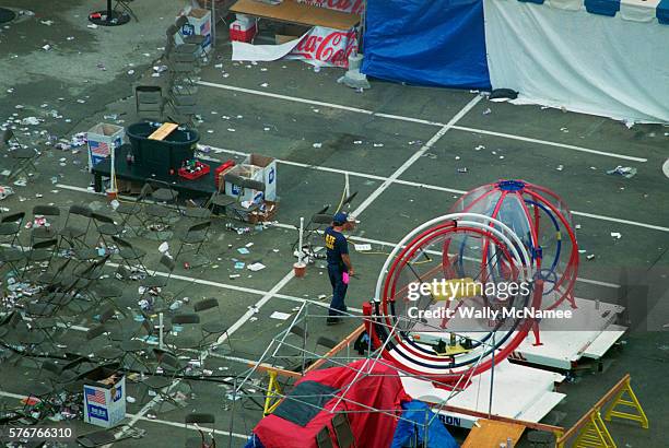 An ATF agent searches for bomb fragments and evidence in connection with a pipe bomb explosion in the Centennial Olympic Park during the 1996 Summer...