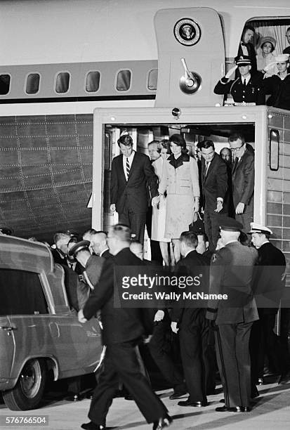 The coffin of President John Fitzgerald Kennedy is moved from Air Force One to an ambulance upon arrival at Andrews Air Force Base. Robert Kennedy,...